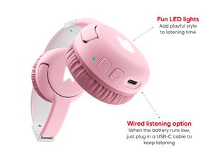 Close-up of ear pad on cloud pink bluetooth headphones for kids, showcasing the USB-C charger and pulsating LEDs light