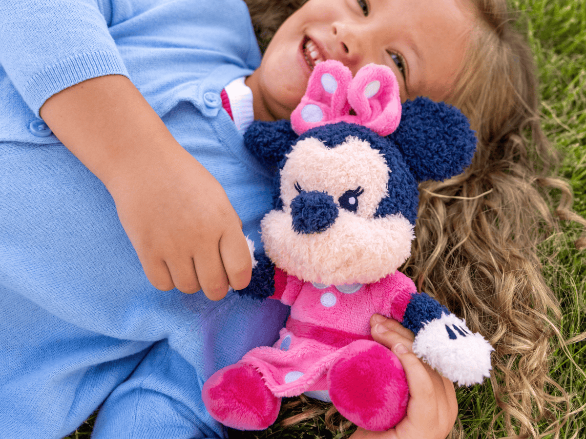 Child playing with minnie mouse cuddle Tonie audio figurine and Toniebox 2