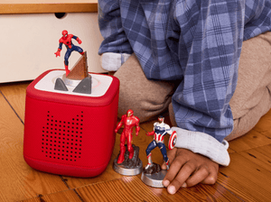 child playing with MARVEL Tonies and a Toniebox 2