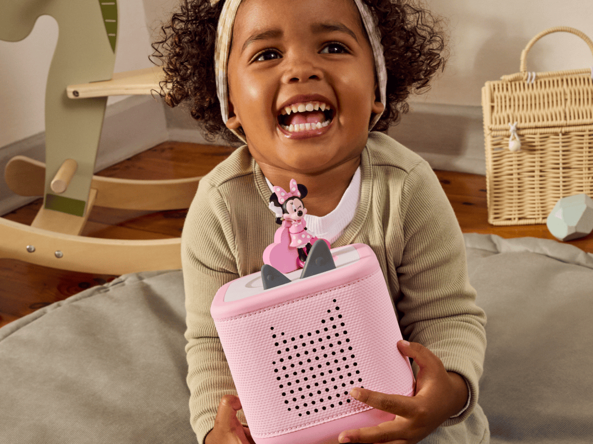 Child playing with a pink toniebox 2 and Disney Minnie Mouse Clubhouse Tonie
