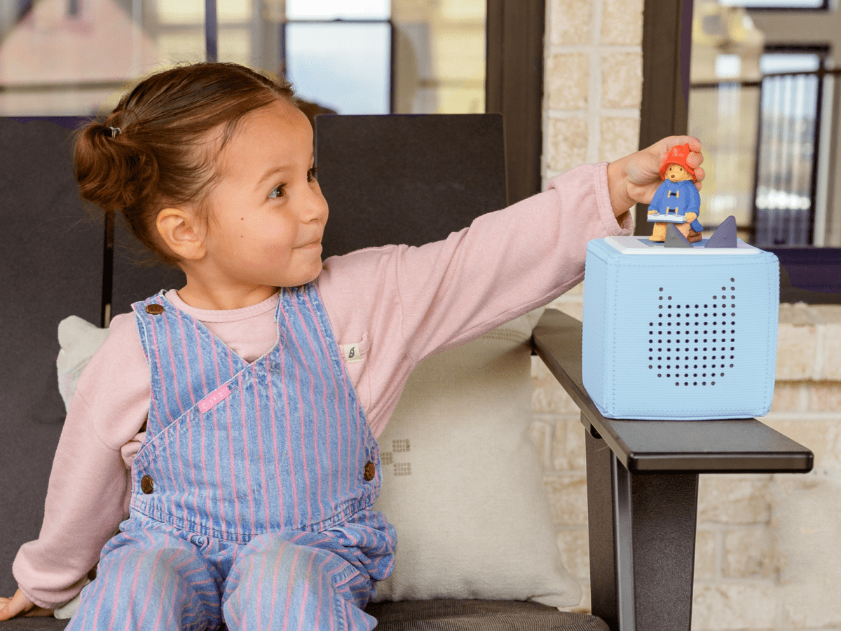 Child playing with Paddington Bear Tonie audio figurine and Toniebox 2