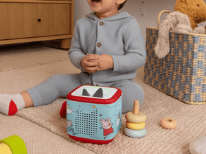 Child Playing With Peppa Pig Sleeve On A Red Toniebox 2