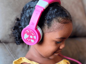 Child Using The Toniesâ® Pink Wired Headphones For Kids