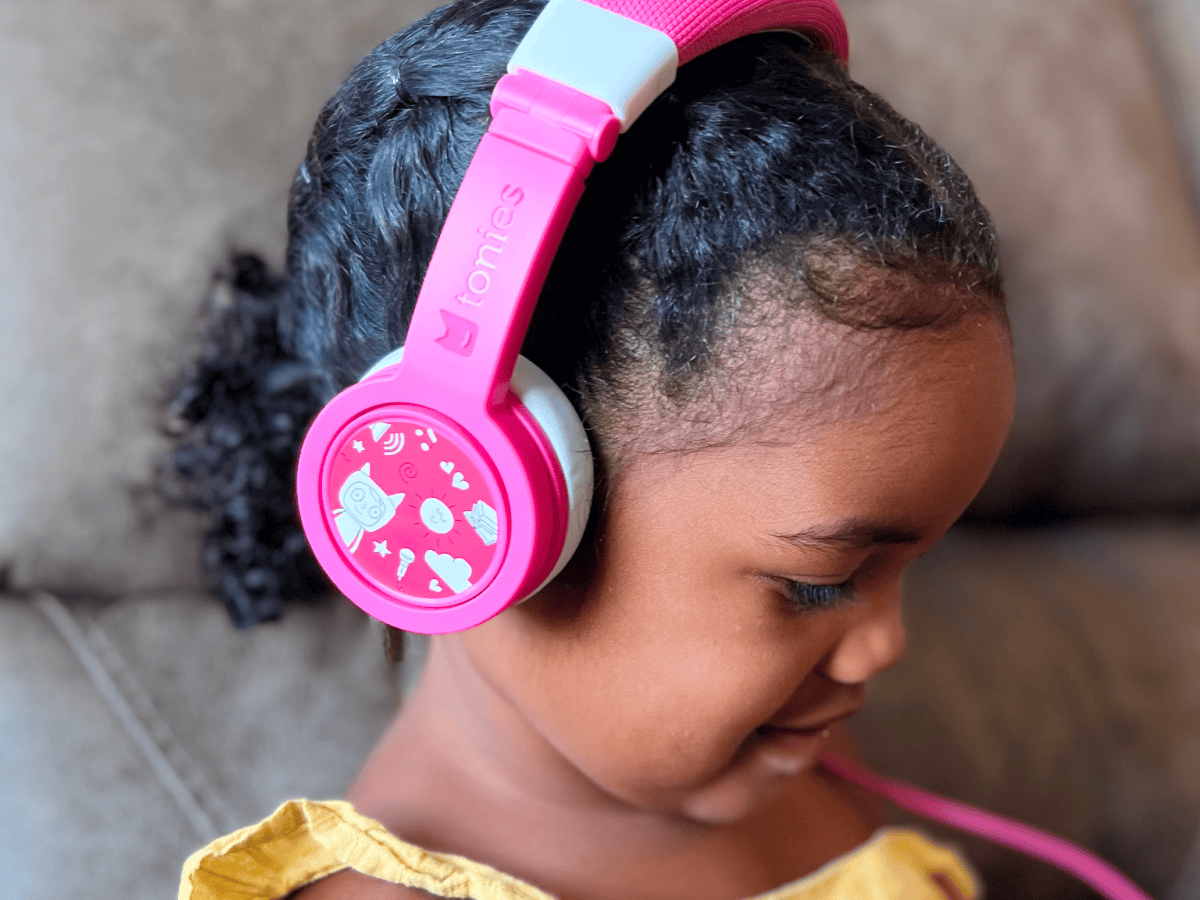 Child Using The Toniesâ® Pink Wired Headphones For Kids