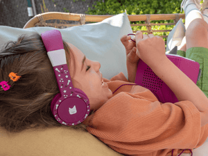 Child Using The Toniesâ® Purple Wired Headphones For Kids