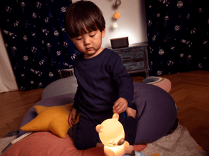 Lifestyle Image of child using Sleepy Friends: Sleepy Bear Night Light Tonie
