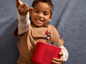 child playing with Marvel Spider-Man Tonie and a red toniebox 2