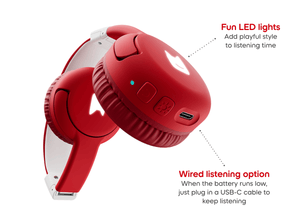 Close-up of ear pad on red bluetooth headphones for kids, showcasing the USB-C charger and pulsating LEDs light