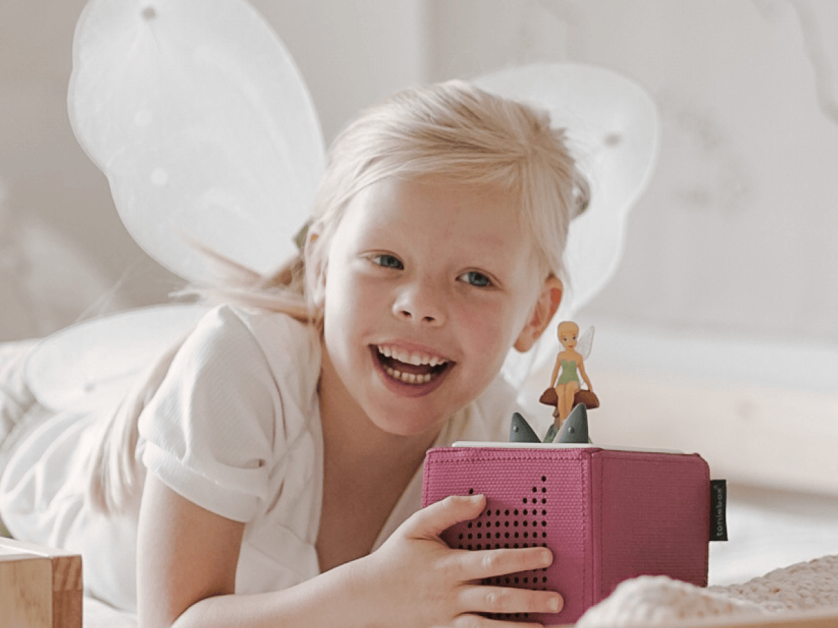 Child Playing With Disney Tinker Bell Tonie